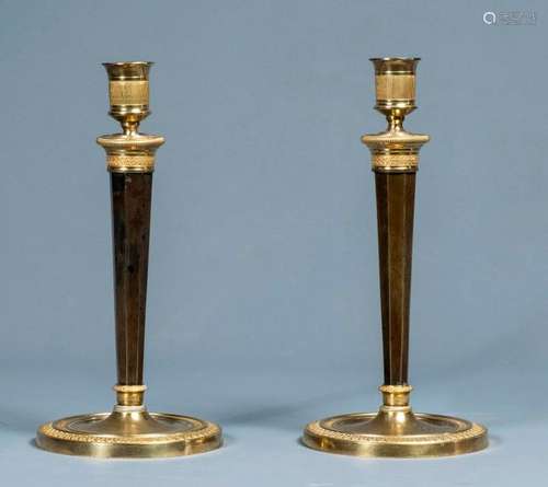 PAIR OF TORCHES \nin gilt bronze with patina. \nEmpi…