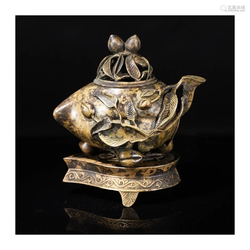 A Hollowedout Copper Peach Incense Burner