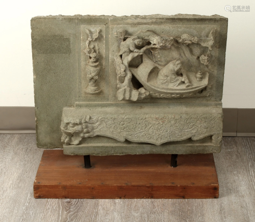 CARVED STONE FRAGMENT ON PLINTH