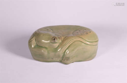 A GREEN GLAZE PILLOW