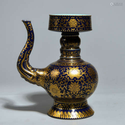 A BLUE GLAZE GOLD PAINTED POT WITH FLOWER PATTERNS