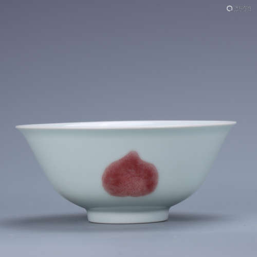 A BOWL WITH FLOWER AND FRUIT PATTERNS