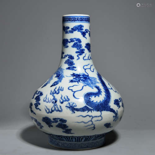 A BLUE-AND-WHITE BOTTLE WITH DRAGON PATTERNS