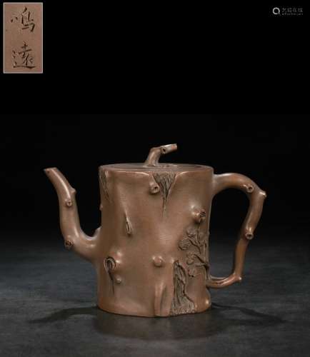 A Zisha Teapot With Plum Pattern And Mark