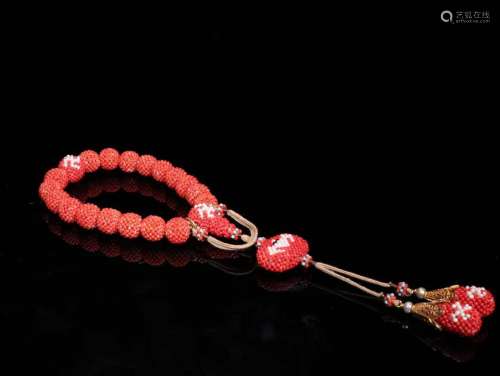 A Red Coral 18-Bead Pendant
