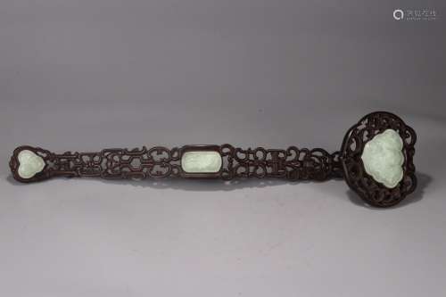 A Rosewood Ruyi Ornament With White Jade