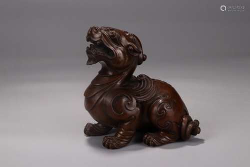 A Huangyang Wood Beast Carved Ornament