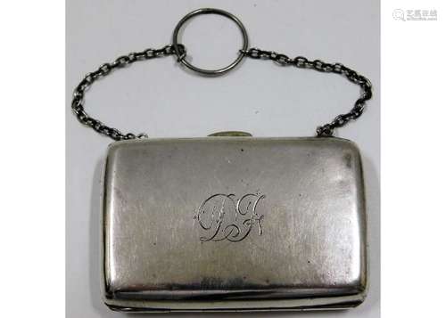 An antique white metal purse with internal textile