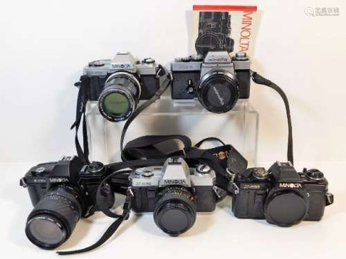Five 35mm film cameras by Minolta: two X300 models