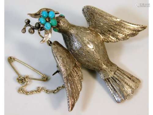 An antique white metal memorial brooch depicting a dove set with natural turquoise, 11.1g