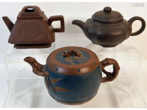 Three small Chinese Yixing teapots, largest 6.5in