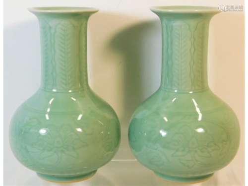 A pair of 20thC. Chinese celadon vases with chased