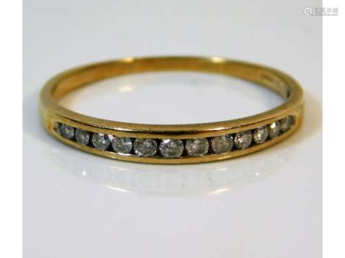 A 9ct gold half eternity ring set with 0.25ct diamonds, size T/U 1.6g