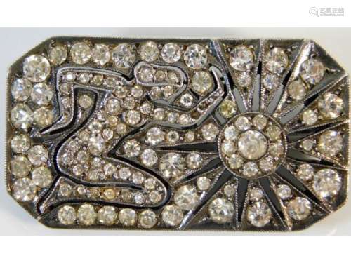 A 0.935 silver art deco brooch set with paste stones within a sun salutation design, 1.5in x 0.75in,