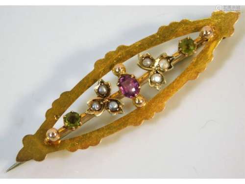 A 9ct gold suffragette style brooch set with peridot, seed pearl & garnet, 2in wide 2.4g