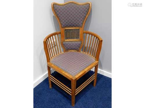 A late 19thC. arts & crafts corner chair with upho