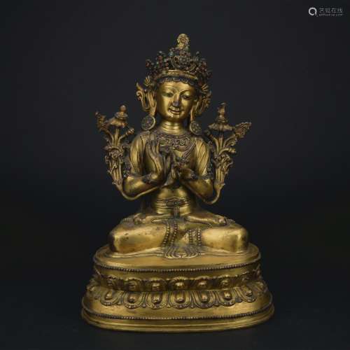 A gilt-bronze figure of Manjusri