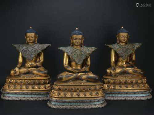 A gilt-bronze figure of Trikalea Buddhas