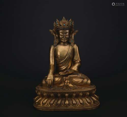 A gilt-bronze figure of Sakyamumi