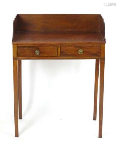 An early 19thC mahogany washstand with a shaped upstand above a single short drawer and faux