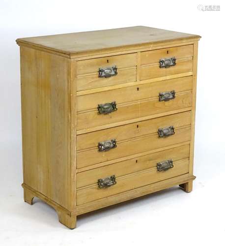 A late 19thC pine chest of drawers with a rectangular top above two short over three long