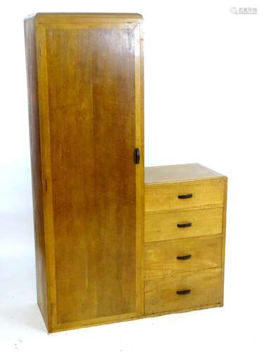 An early / mid 20thC oak wardrobe / dressing chest. Having a single long door opening to show