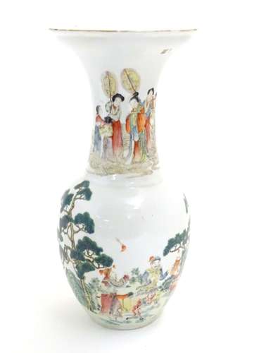 An Oriental baluster vase with an elongated neck and flared rim, the body decorated with figures and