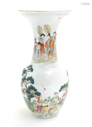 An Oriental baluster vase with an elongated neck and flared rim, the body decorated with figures and