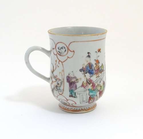 A Chinese export famille rose mug / tankard decorated with figures in a domestic interior scene, and
