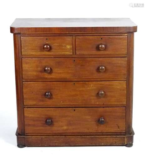 A late 19thC mahogany chest of drawers comprising two short over three long graduated drawers with