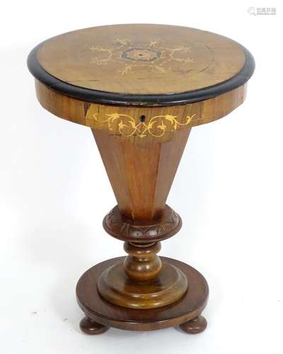 A mid 19thC walnut sewing table with a circular marquetry inlaid top having ebonised banding to