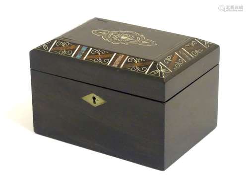 A Victorian tea caddy with a decorative border and motif with painted detail and inlaid abalone,