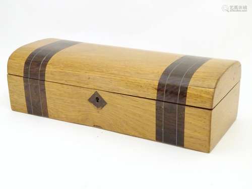 A late 19th / early 20thC glove box with a domed lid and banded decoration and inlaid stringing