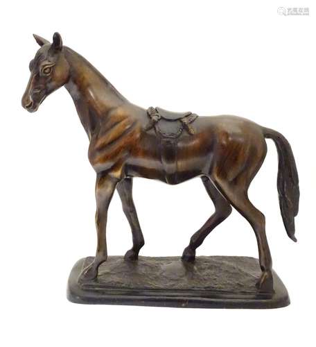 A 20thC bronze sculpture modelled as a standing horse on a rectangular base. Approx. 12 1/2