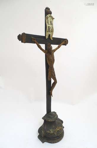 A large 19thC polychrome crucifix with an I. N. R. I. flag and a carved wooden Corpus Christi,