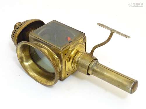 A 19thC brass carriage lamp, with mounting bracket. 16