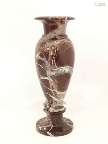 A specimen marble vase of baluster form with a flared rim. Approx. 11 3/4