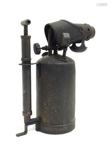 A large early 20thC blow torch by Primus, Sweden, with plunger, gauge and taps, 14 1/2