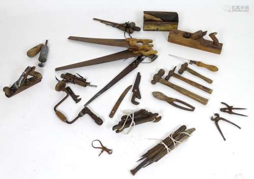 A large quantity of assorted vintage tools to include saws, hammers, chisels, files, spanners,