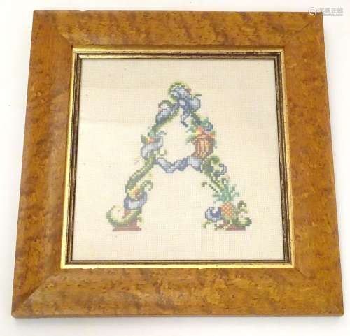 A 20thC cross stitch embroidery / needlework depicting the alphabet letter A formed from stylised