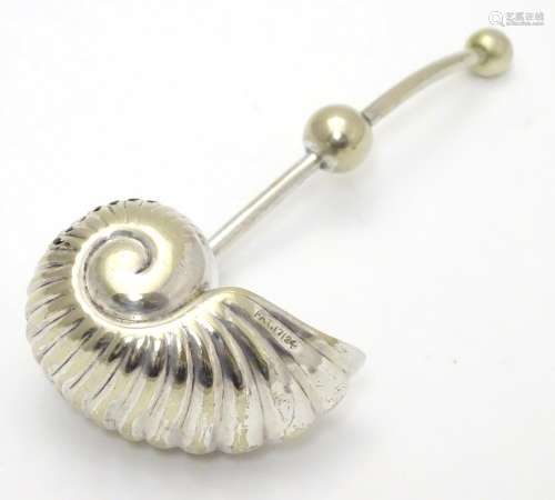 An unusual silver plated sugar sifter spoon formed as a Nautilus shell, with patent stamp PAT