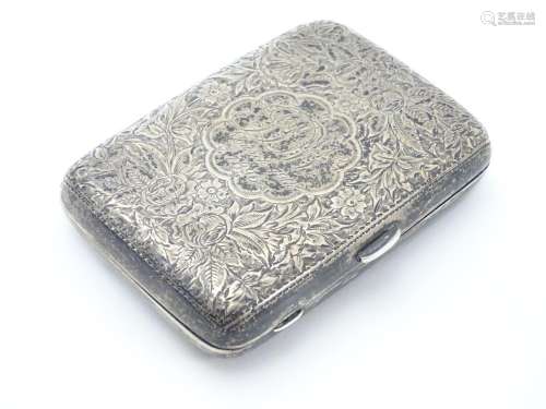 A Victorian silver cigarette case with engraved floral and foliate decoration. Hallmarked Birmingham
