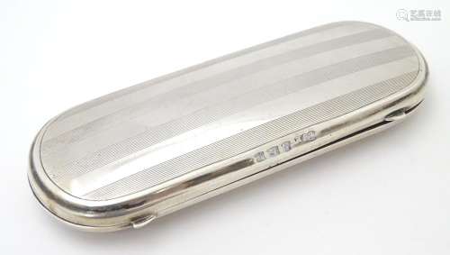 A silver spectacle / glasses case with engine turned decoration. hallmarked Birmingham 1921 maker