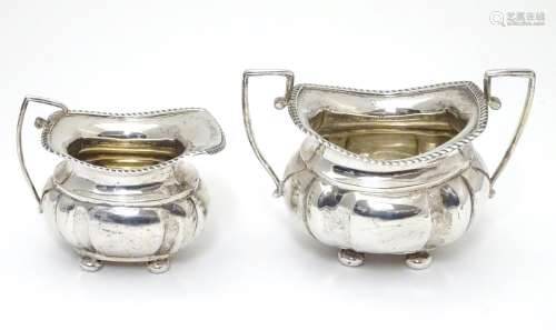 A silver sugar bowl and milk jug hallmarked Chester 1904 maker George Nathan & Ridley Hayes (28g) (