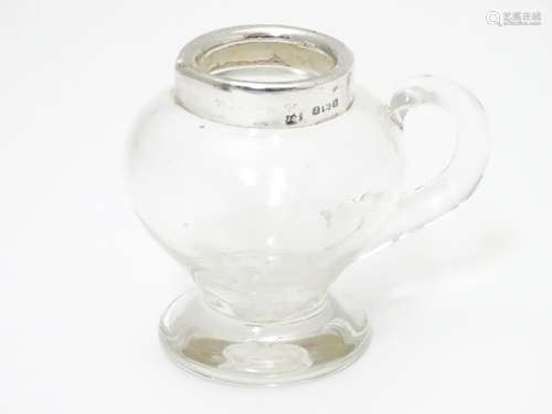 A glass jug / noggin with silver mount hallmarked Birmingham 1907 maker Jones & Crompton 2 3/4