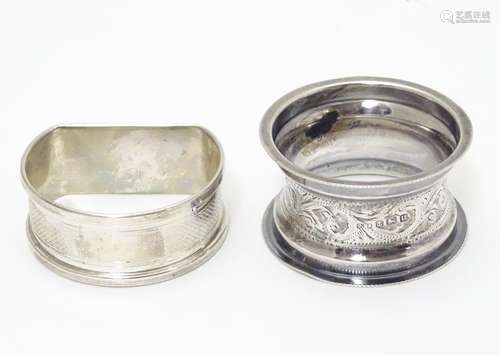 Two silver napkin rings, one D-shaped with engine-turned decoration, hallmarked Birmingham 1965