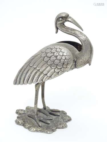 A white metal model of a stork / crane. indistinctly marked under. Approx. 4 1/2