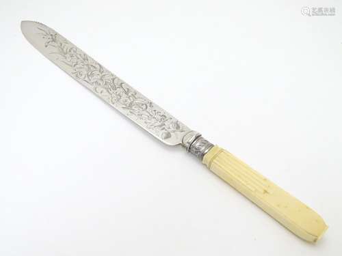 A cake knife with silver plate blade 13 1/2