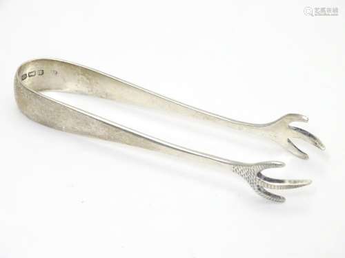 Silver sugar tongs with bird?s claw formed grips. Hallmarked Birmingham 1938 maker Barker Bros