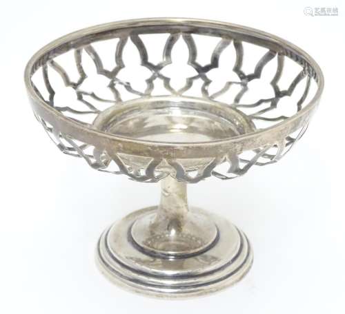 A silver openwork pedestal bonbon dish on weighted base. Hallmarked Birmingham 1909 maker